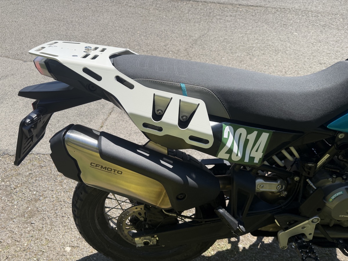 Finished rack — white powder coat, Mosko Moto bags loaded at riding course