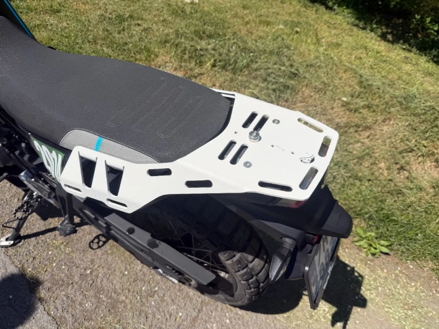 CFMOTO 800MT-X rack — real world detail shot, muddy conditions